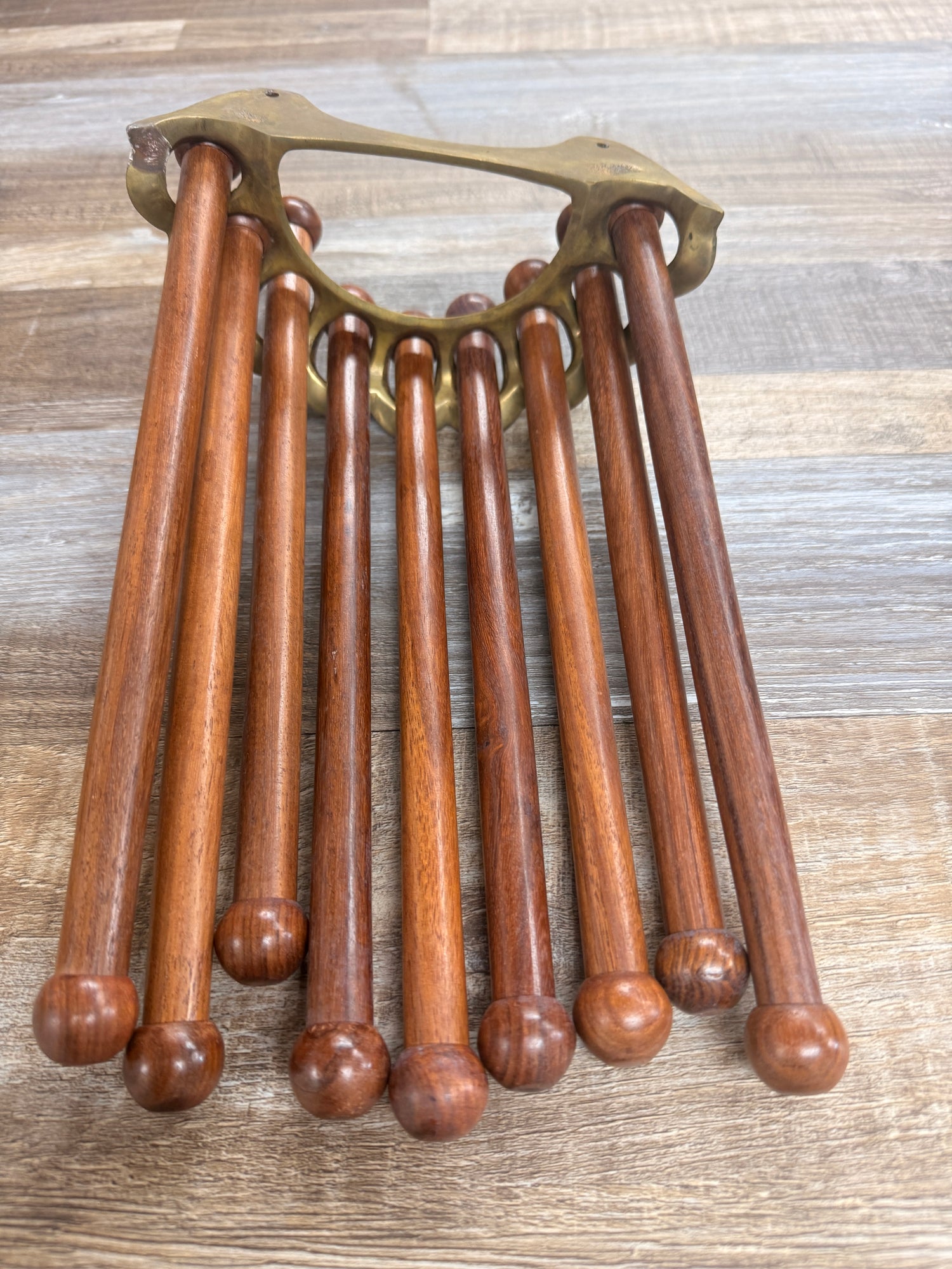 brass and wood dowel tack hanger for tack room