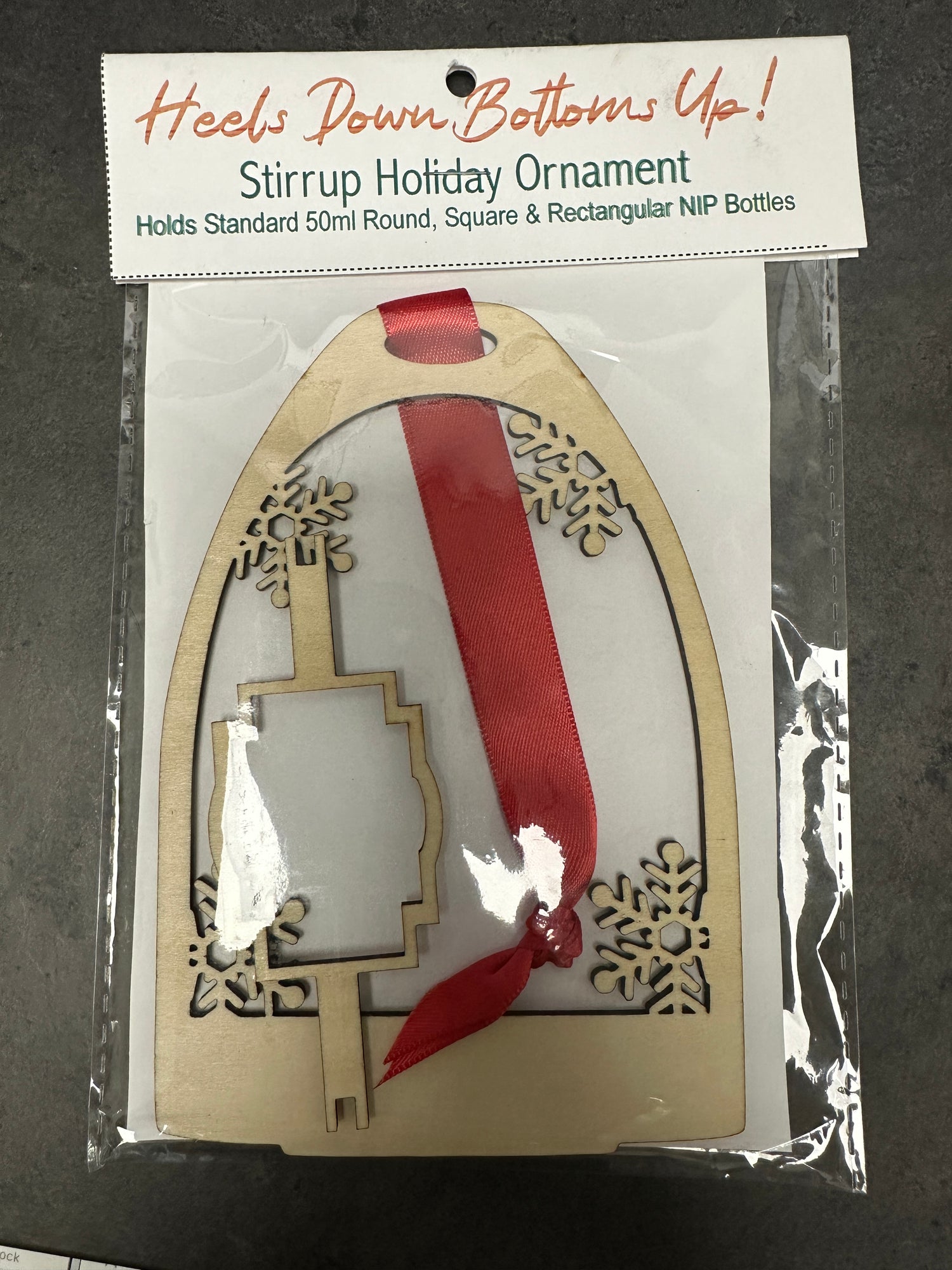 Heels Down Bottoms Up! Natural color Stirrup Ornament holds NIP Bottles