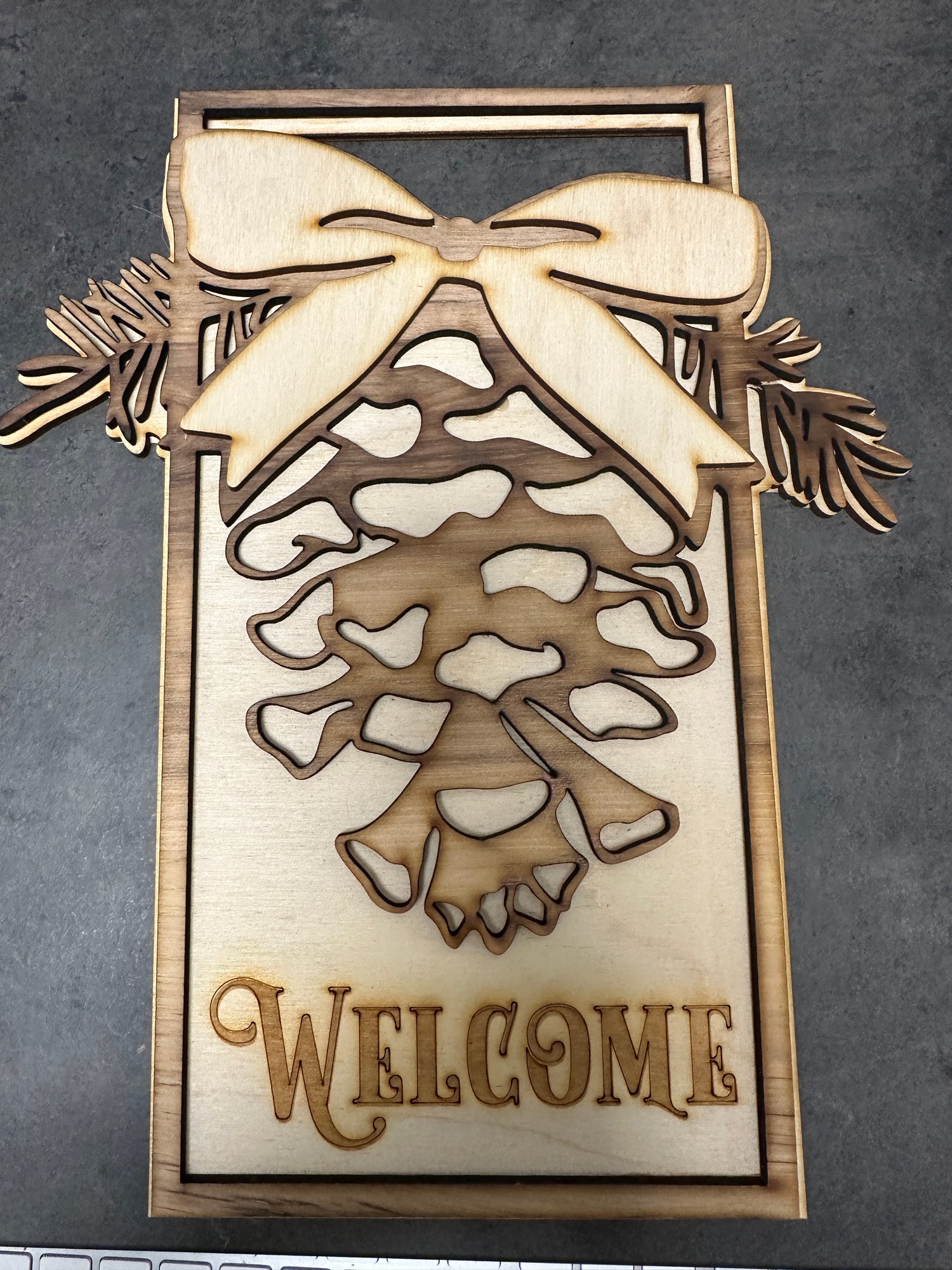 Pinecone Laser Engraved Welcome Sign